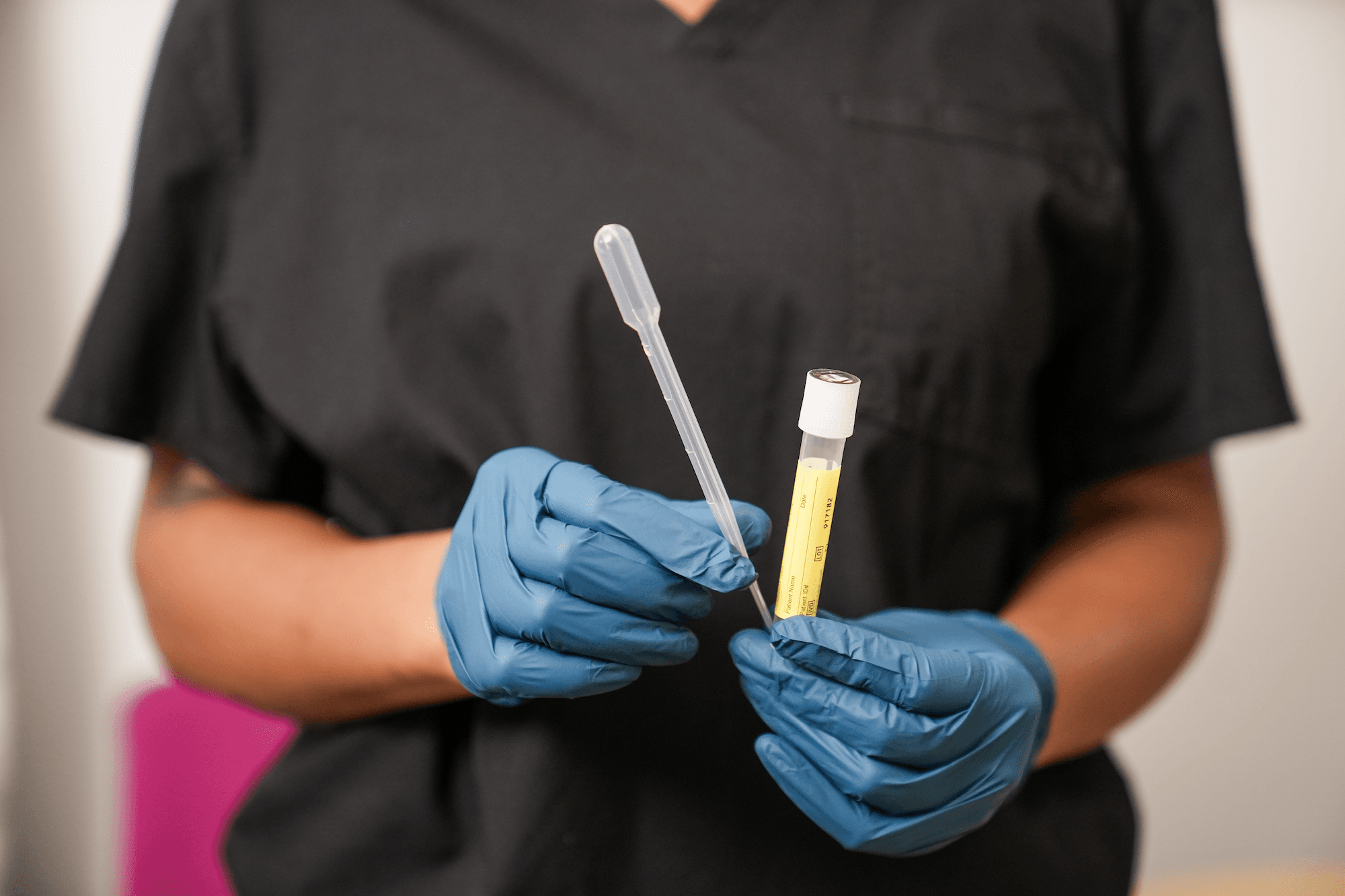 Nurse holding STI testing equipment Nurse holding STI testing equipment
